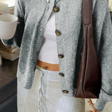 Minimalistisk cardigan med lange ærmer og knapper