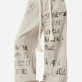 Abrikosfarvede denimjeans med lige ben og graffitiprint