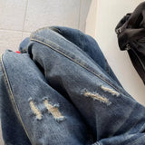 Casual utility jeans med vide, buede ben og en slidt look