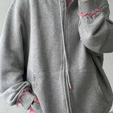 Oversized falmet lyserød hættetrøje med lynlås