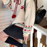 Oversized vest med pomponer