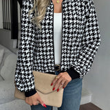 Tætsiddende, langærmet jakke med houndstooth-mønster
