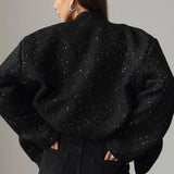 Paillettejakke med høj krave og lommer