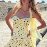 Tulipan minikjole med åben ryg og polkaprikket bælte