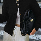 Minimalistisk cardigan med lange ærmer og knapper