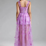 Aftenkjole med spaghettistropper og sommerfuglemotiv