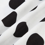 Todelt sæt med top med polkaprikker og flagermusærmer