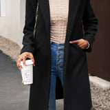 Lang, ensfarvet frakke i uldblanding