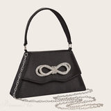 Elegant silke brudeclutch med sløjfe af rhinsten