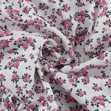 Todelt sæt: langærmet skjorte med blomsterkrave, flæseshorts