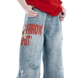 Brede jeans med falmet broderi