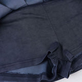 Sæt med plisseret nederdel og bindebånd foran i ensfarvet strik