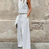 Todelt kontorsæt: hvide, ærmeløse bukser med V-hals og print