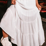 Lang, højtaljet A-formet nederdel med kontrasterende snøre, boheme-chic stil