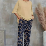 Chic sæt med asymmetrisk top og vide, blomstrede bukser til kvinder