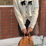 Ribbet cardigan med glitrende sløjfe