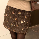 Kort, højtaljet A-formet nederdel med pailletter