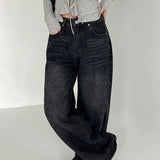 Jeans med vide ben og lommer, trykt med en falmet butterfly