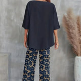 Chic sæt med asymmetrisk top og vide, blomstrede bukser til kvinder