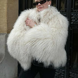 Kort vest i kunstpels og lammeskind