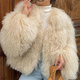 Kort vest i kunstpels og lammeskind