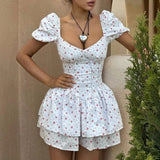 Minikjole med bindebånd i taljen og flæser, pufærmer