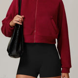 Atletisk fleece yogajakke med opretstående krave og lynlås