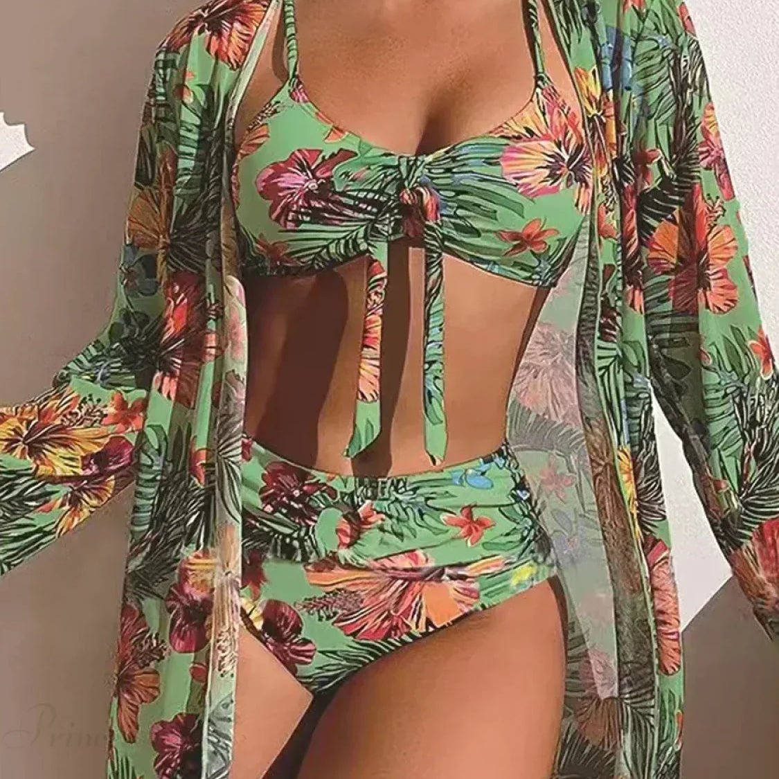 Todelt sæt med lange ærmer og en blomstersløjfe foran