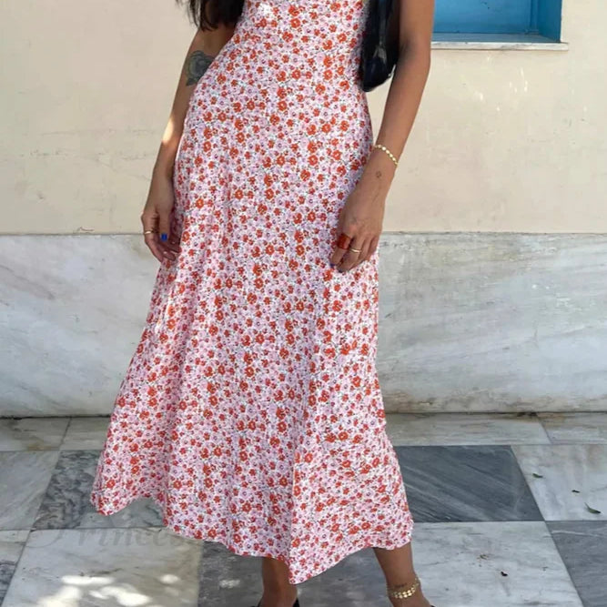 Kjole med blomsterprint, V-hals, kontrastdetaljer og snørebånd i ryggen