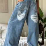 Lige, lavtaljede jeans med vide ben, slidt look og hjertemønster