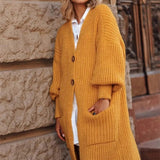 Damestrikfrakke – Tyk uld – Oversized pasform – Lang – Knappet – Lommer