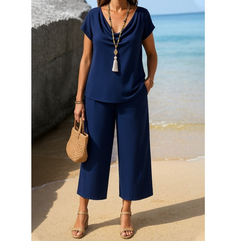 Damesæt – Kortærmet top med draperet krave – Højtaljede bukser med vide ben