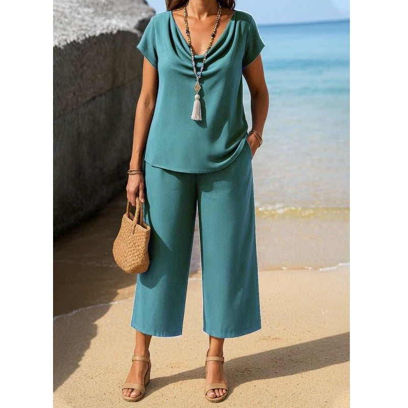 Damesæt – Kortærmet top med draperet krave – Højtaljede bukser med vide ben