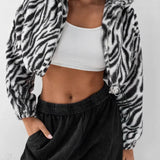 Tyk, luftig fleeceforet jakke med leopardprint