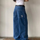 Vide, afslappede jeans med minimalistisk broderi på lommerne