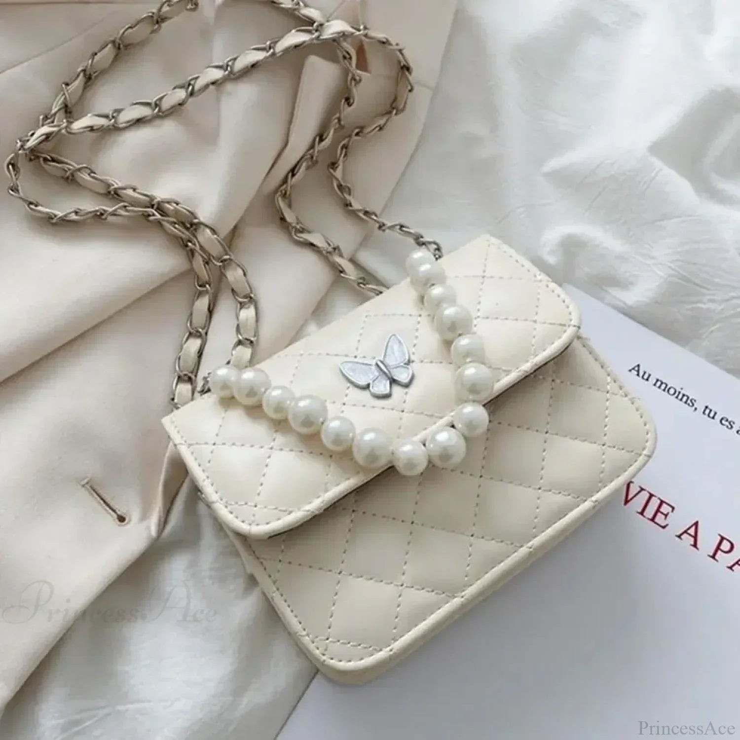 Skuldertaske i PU-læder med perler, tote-stil.