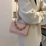 Skuldertaske i PU-læder med metalkæde