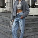 Højtaljede retro jeans med lige ben og hjerte-graffitiprint