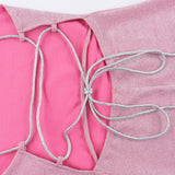 Kort aftenkjole med bar ryg og glitrende sløjfe