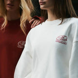 Løstsiddende sweatshirt med rund hals og ensfarvet bogstavprint