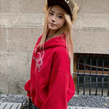 Kort hættetrøje med lynlås, slangeprint og rhinsten