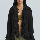 Lang, løstsiddende cardigan med frynser i ensfarvet strik