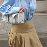 Ensfarvet højtaljet plisseret maxinederdel