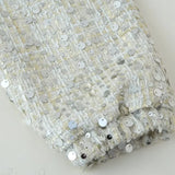 Paillettejakke med høj krave og lange ærmer