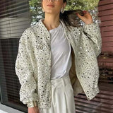 Paillettejakke med høj krave og lange ærmer