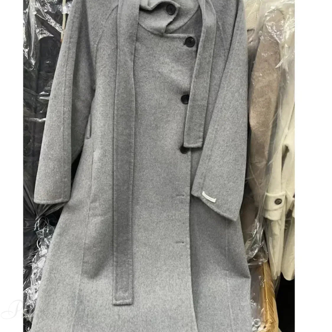 Uldfrakke med rullekrave og enkeltradede knapper