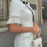 Elegant tweed midikjole pyntet med perler og sløjfe