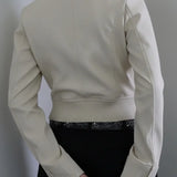 Ensfarvet utilityjakke med lommer, opretstående krave og tætsiddende talje