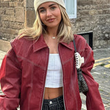 Løstsiddende vintage læderjakke med lange ærmer og revers